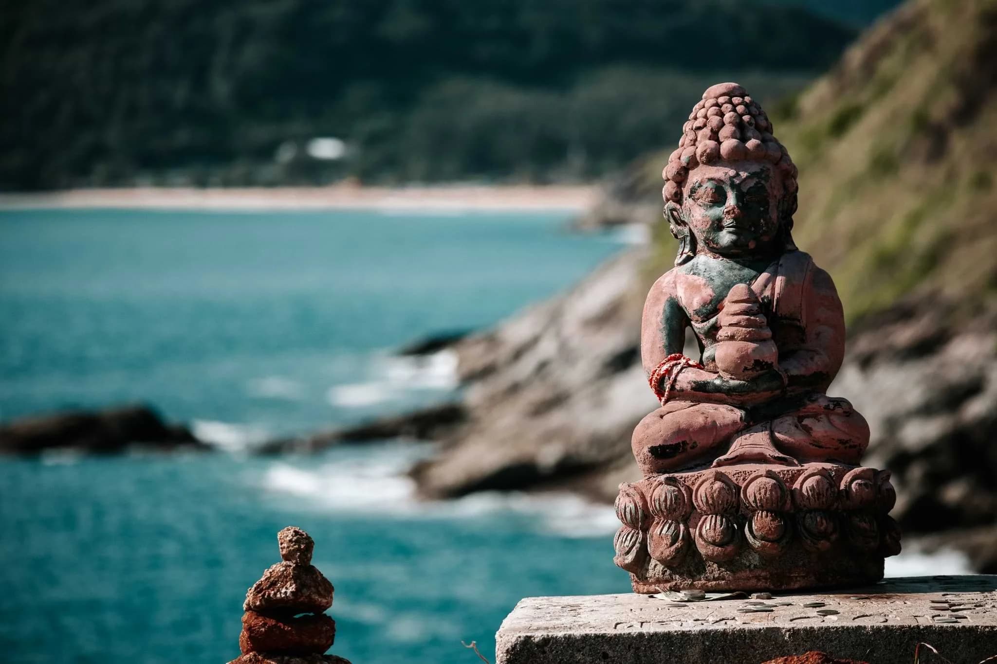 A Buddha statue among the cliffs at Nai Harn